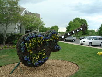 Guitar of flowers on Hotel lawn.